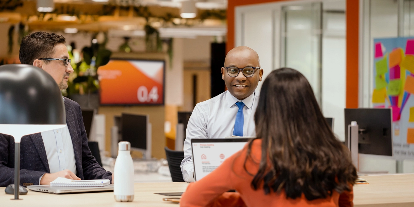 Three people meeting and collaborating