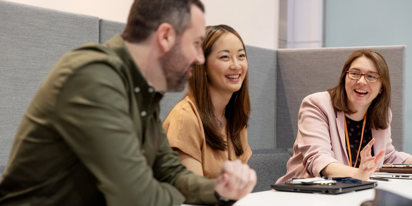 Three people meeting and collaborating