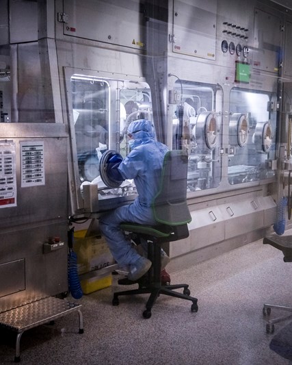 Scientist works in a futurist vaccine laboratory for GSK