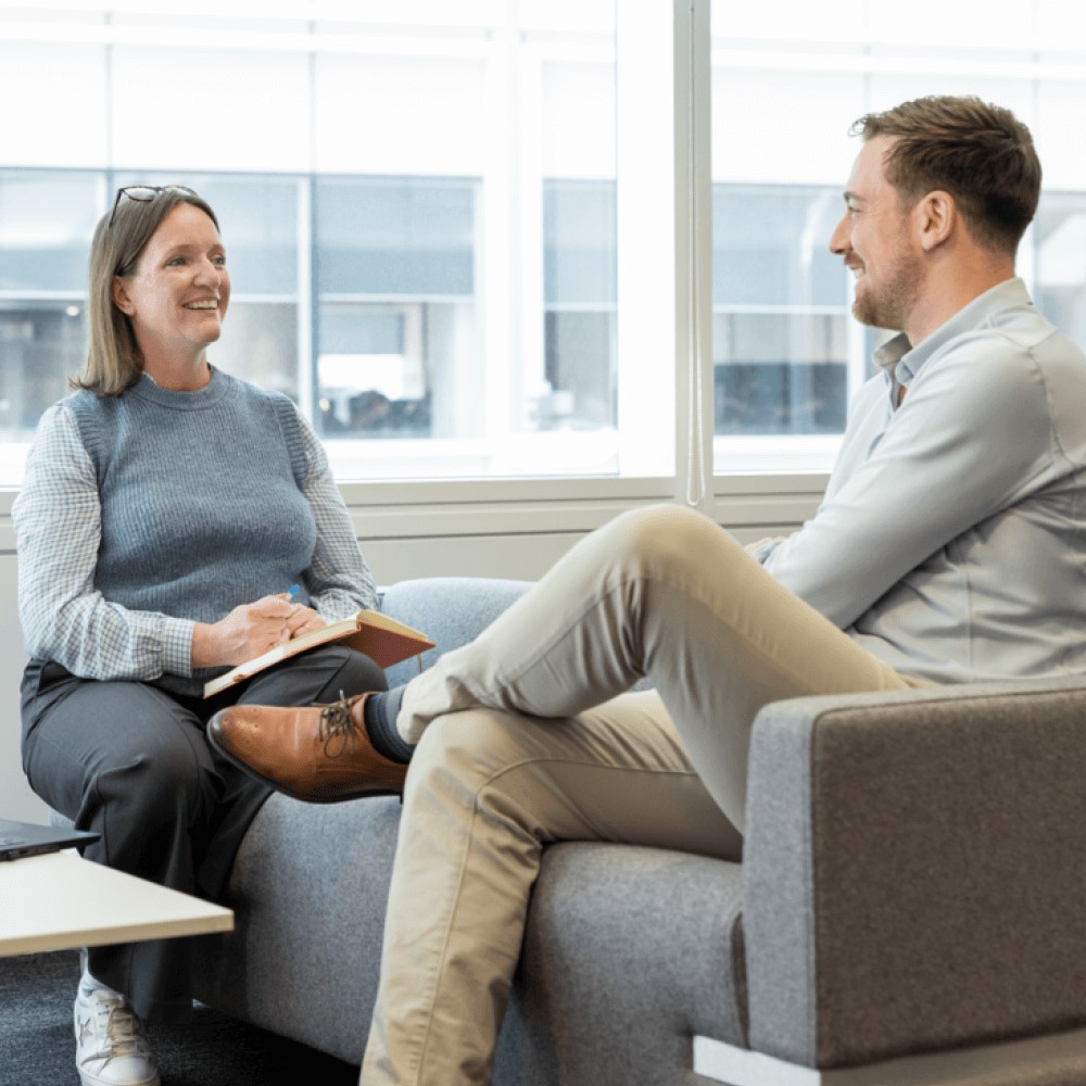 two people talking in an office