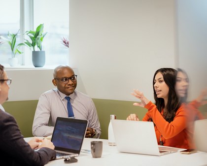 Three people meeting and collaborating