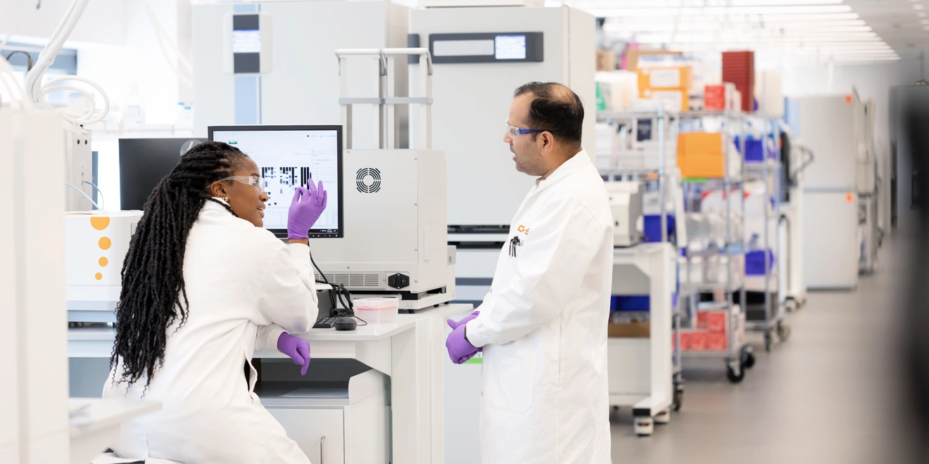 Two scientists talking in Upper Providence Lab