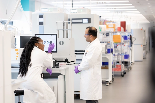 Two scientists talking in Upper Providence Lab
