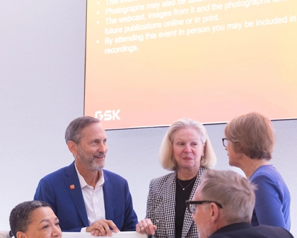 Group of four Board of Directors, men and women in discussion with CFO Julie Brown