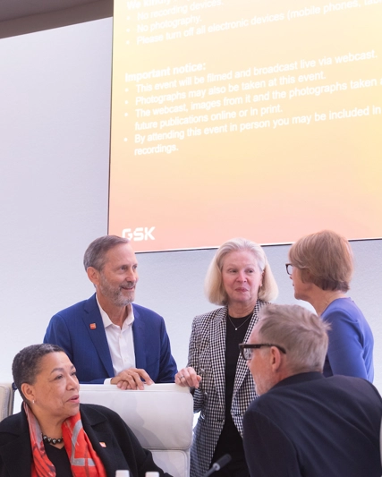 Group of four Board of Directors, men and women in discussion with CFO Julie Brown