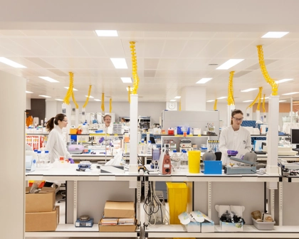 Multiple women working in a large laboratory
