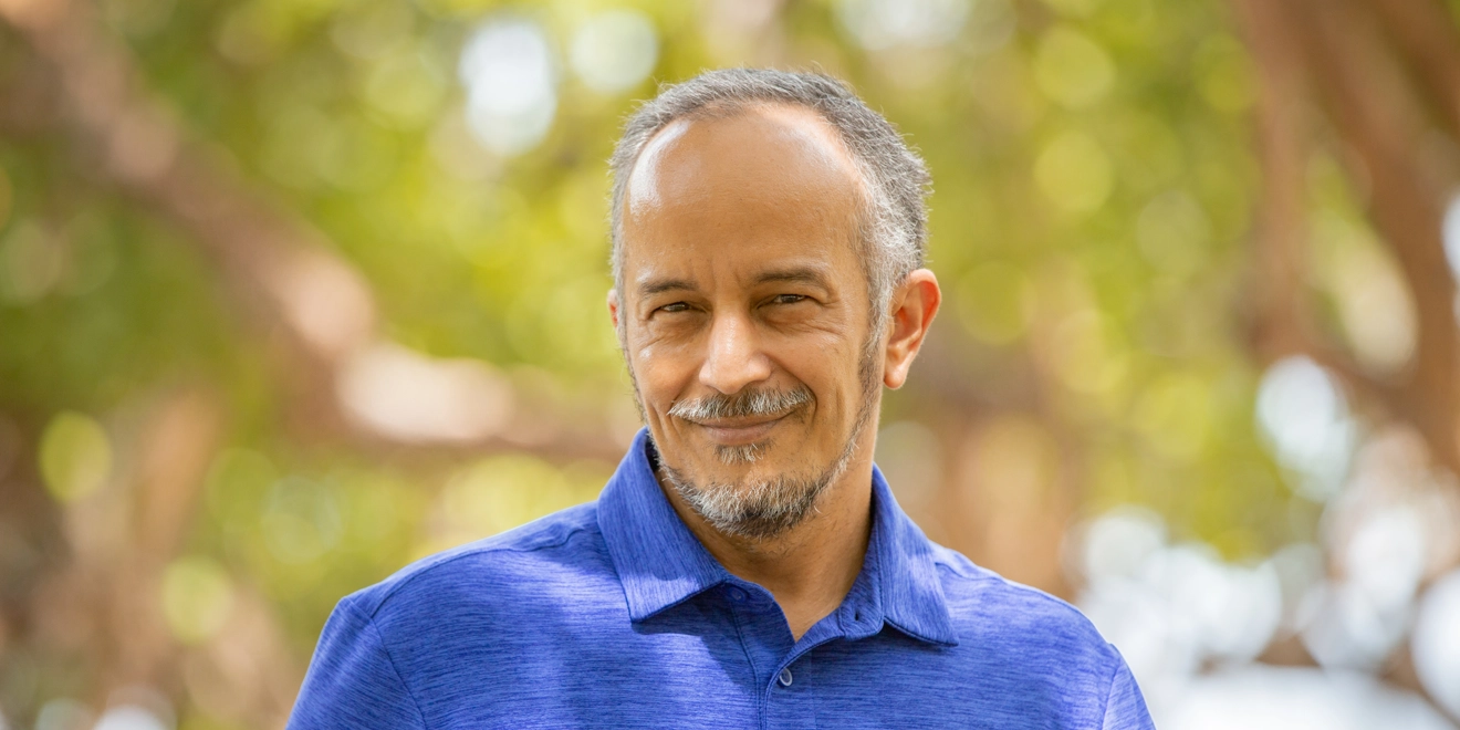 Middle aged man smiling in the park