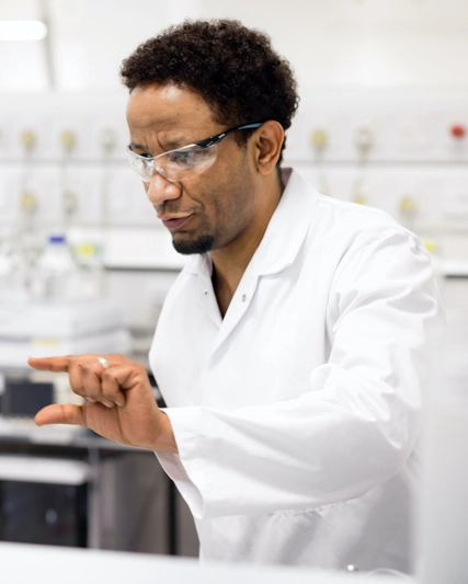 GSK quality lab team members collaborating and engaged in focussed task