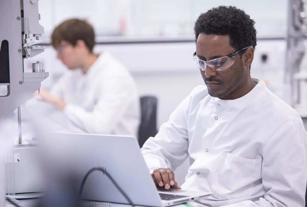 Scientist working on a laptop