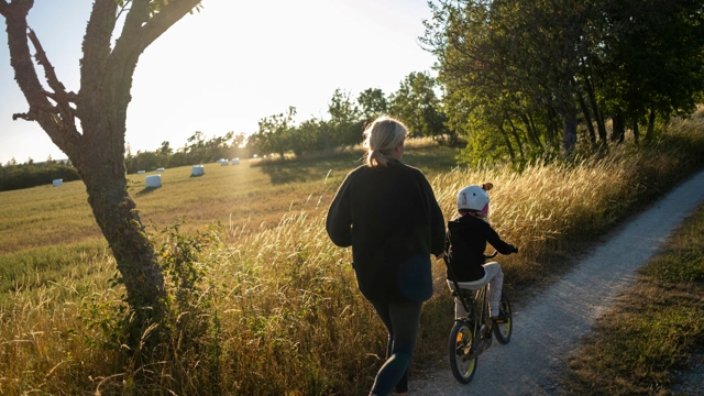 Woman and child riding a bike