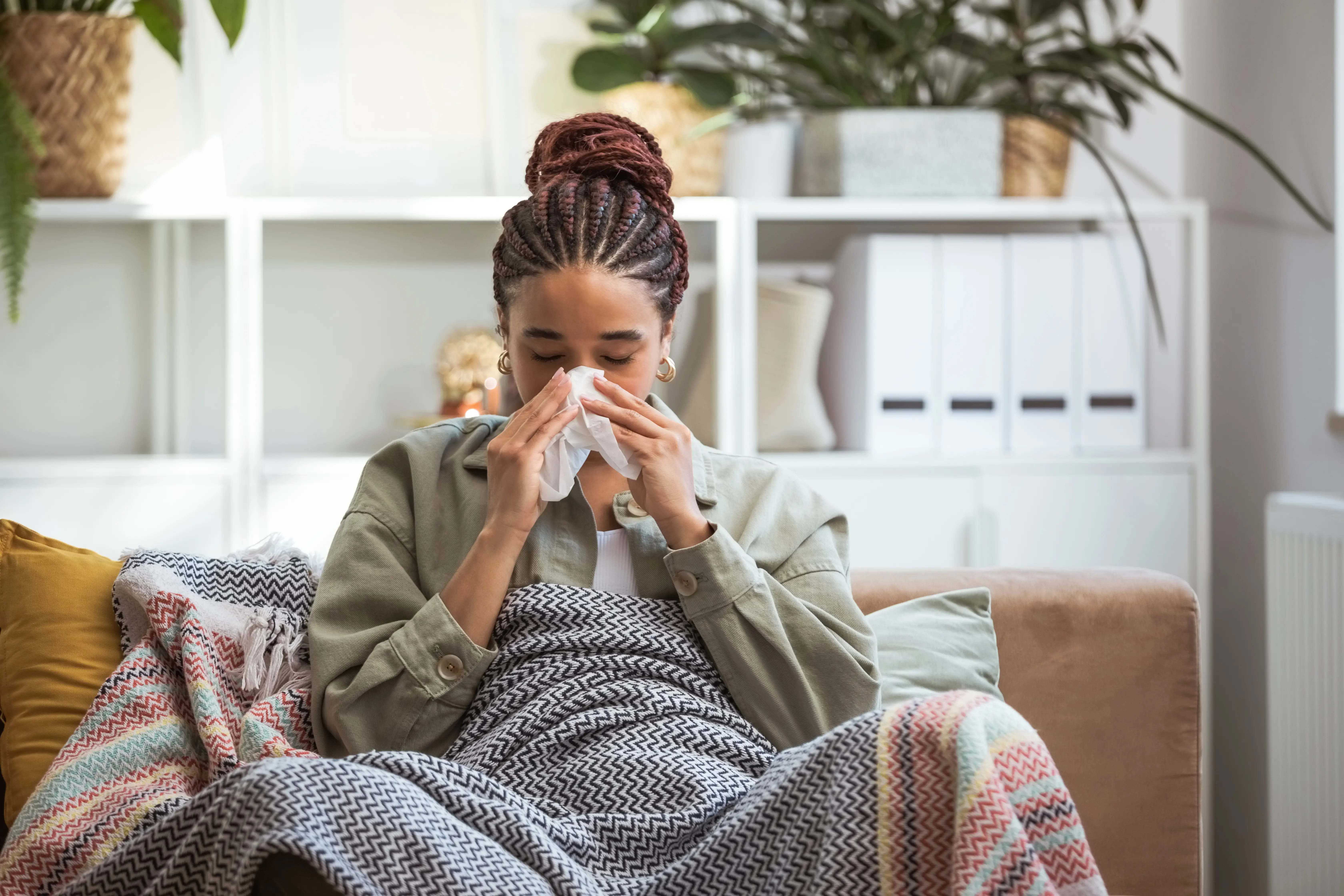 woman sneezing