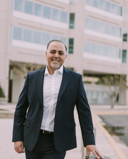 Hesham Abdullah standing in front of the office