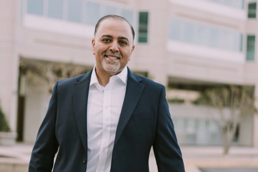 Hesham Abdullah standing in front of the office