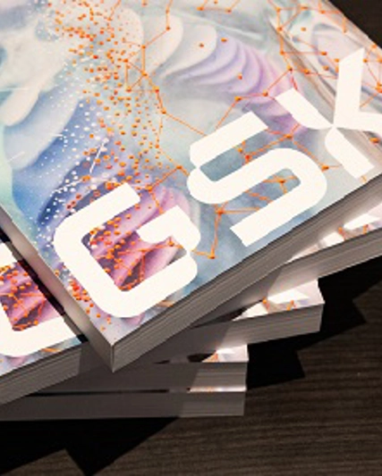 Stack of reports, slightly spread out, with GSK on front cover