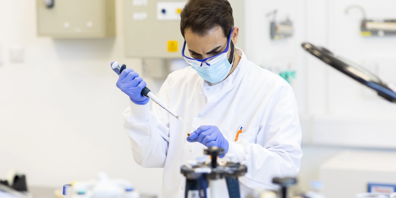 Lab worker performing an experiment