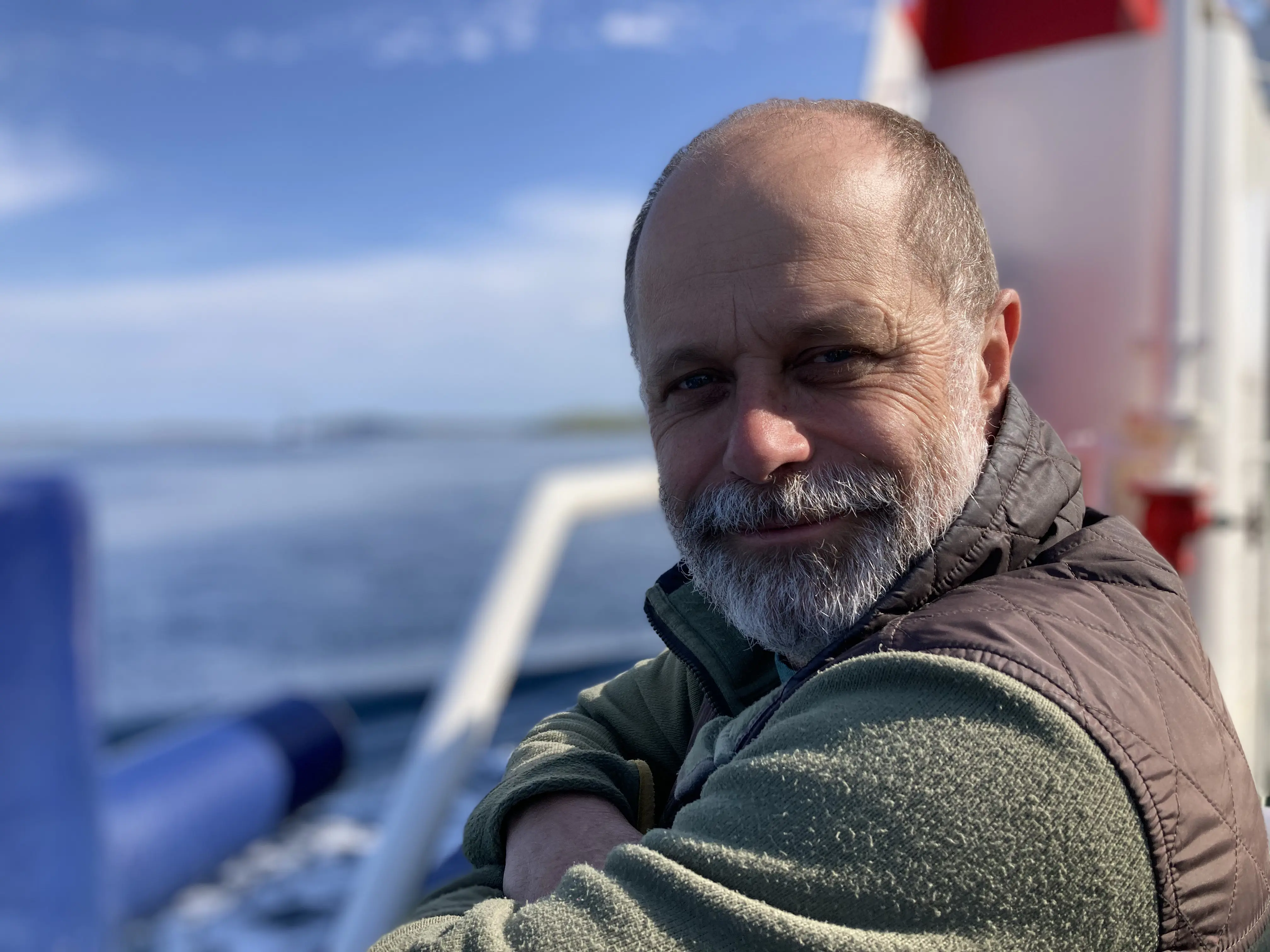 Patient standing on balcony, looking at camera