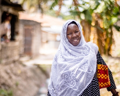 Woman smiling as she walks