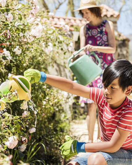 Child watering flowers